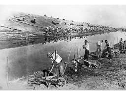 scariolanti sugli argini della Fiuma